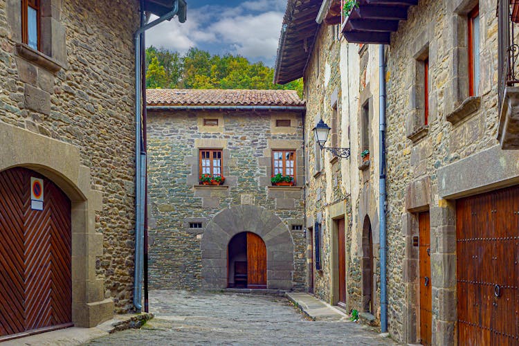 Narrow Street Between Brick Buildings