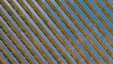 Textured background of solar panels in countryside field
