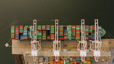 Colorful cargo containers on ship near pier