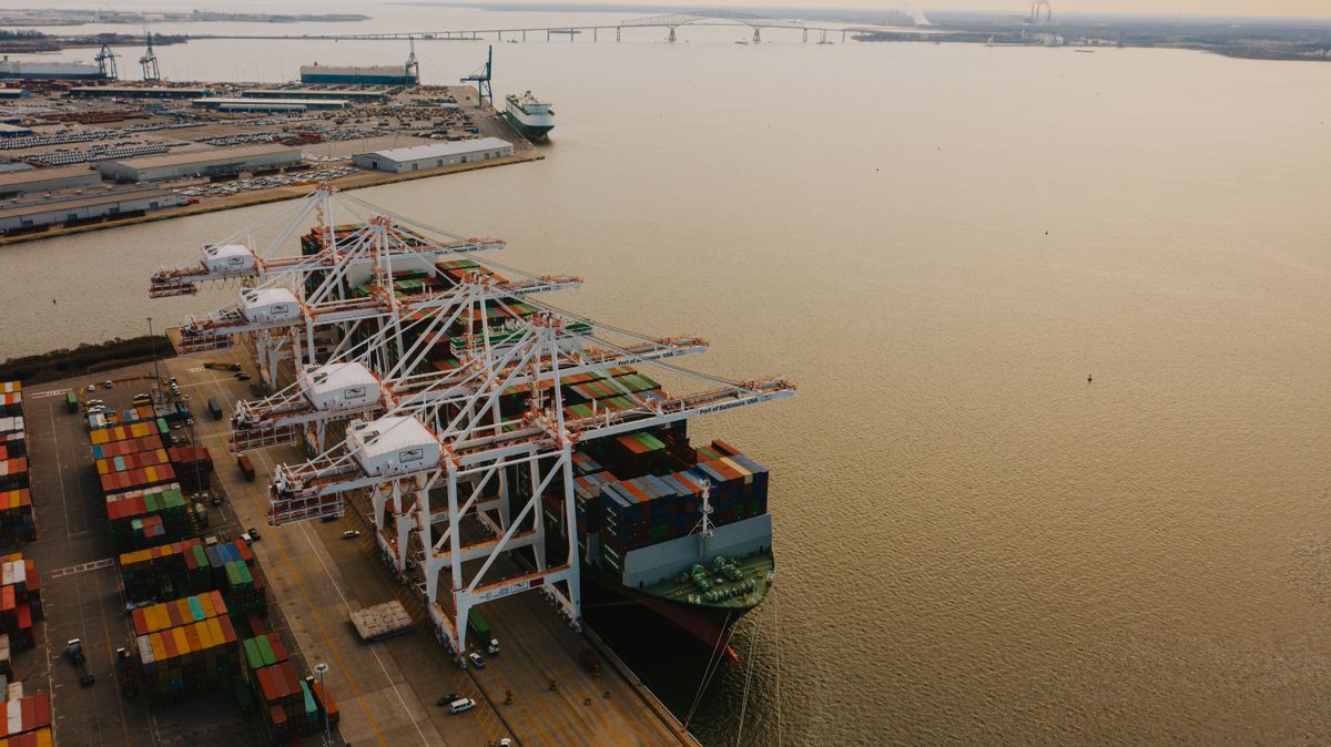 Cargo cranes loading ship containers