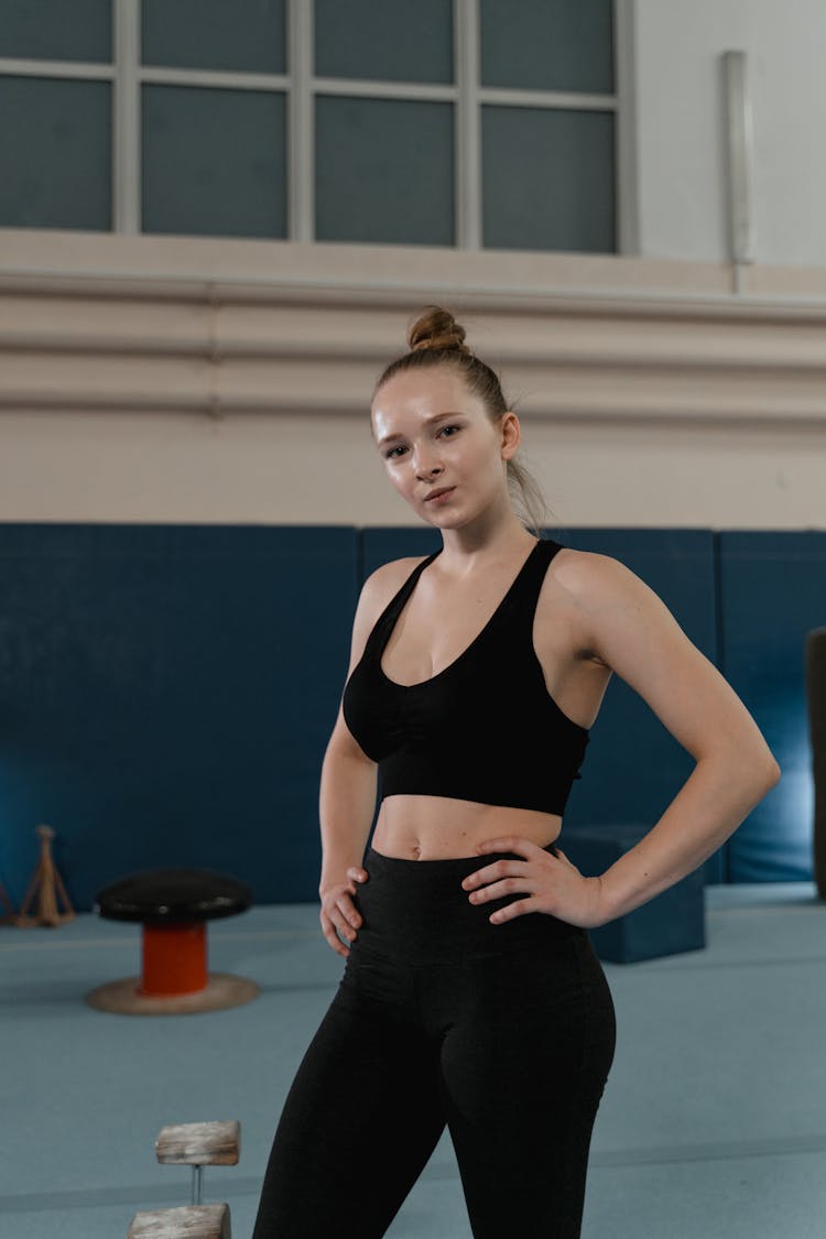 A Woman Posing While Hands On Her Hip