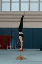 Woman Doing Arm Balance on Contortion Equipment