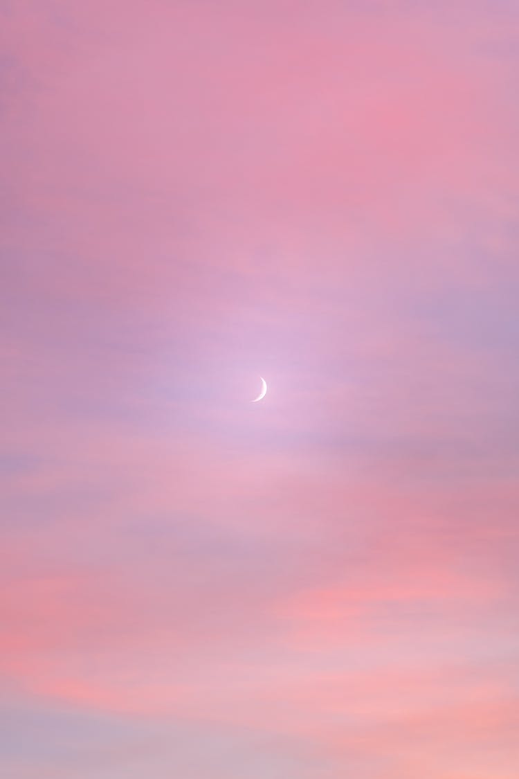 Crescent Moon In The Sky At Sunset