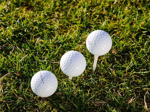 Three Golf Balls on Tee