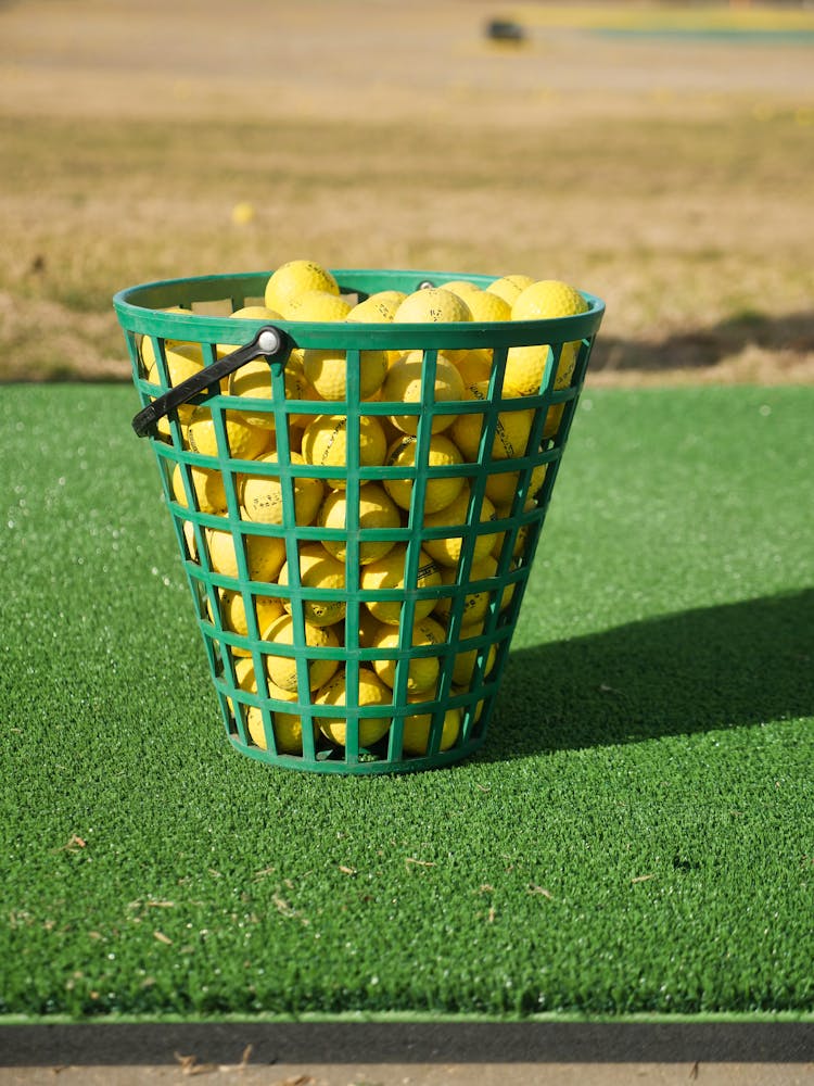 A Basket Of Yellow Golf Balls