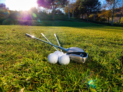 Free White Golf Balls and Silver Golf Clubs Stock Photo
