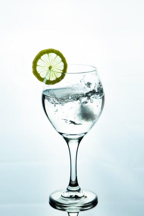 Clear Cocktail Glass With Sliced Lemon
