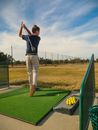 A Boy Finish Position of Golf Swing