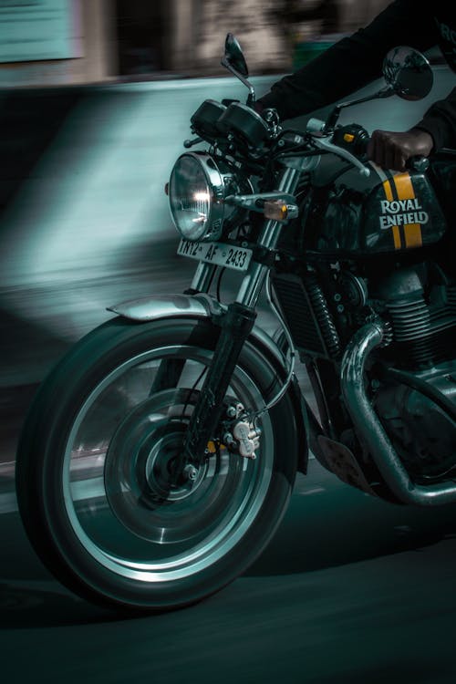 Photo of Person Driving a Motorcycle