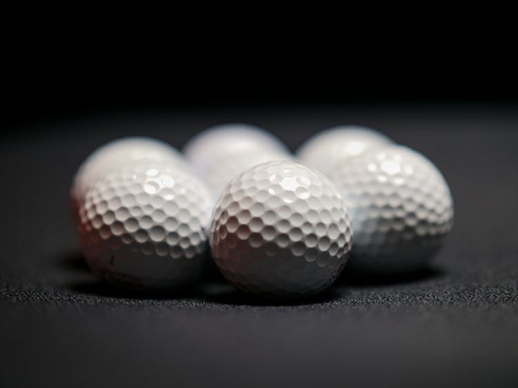 White Golf Balls In Close Up Shot