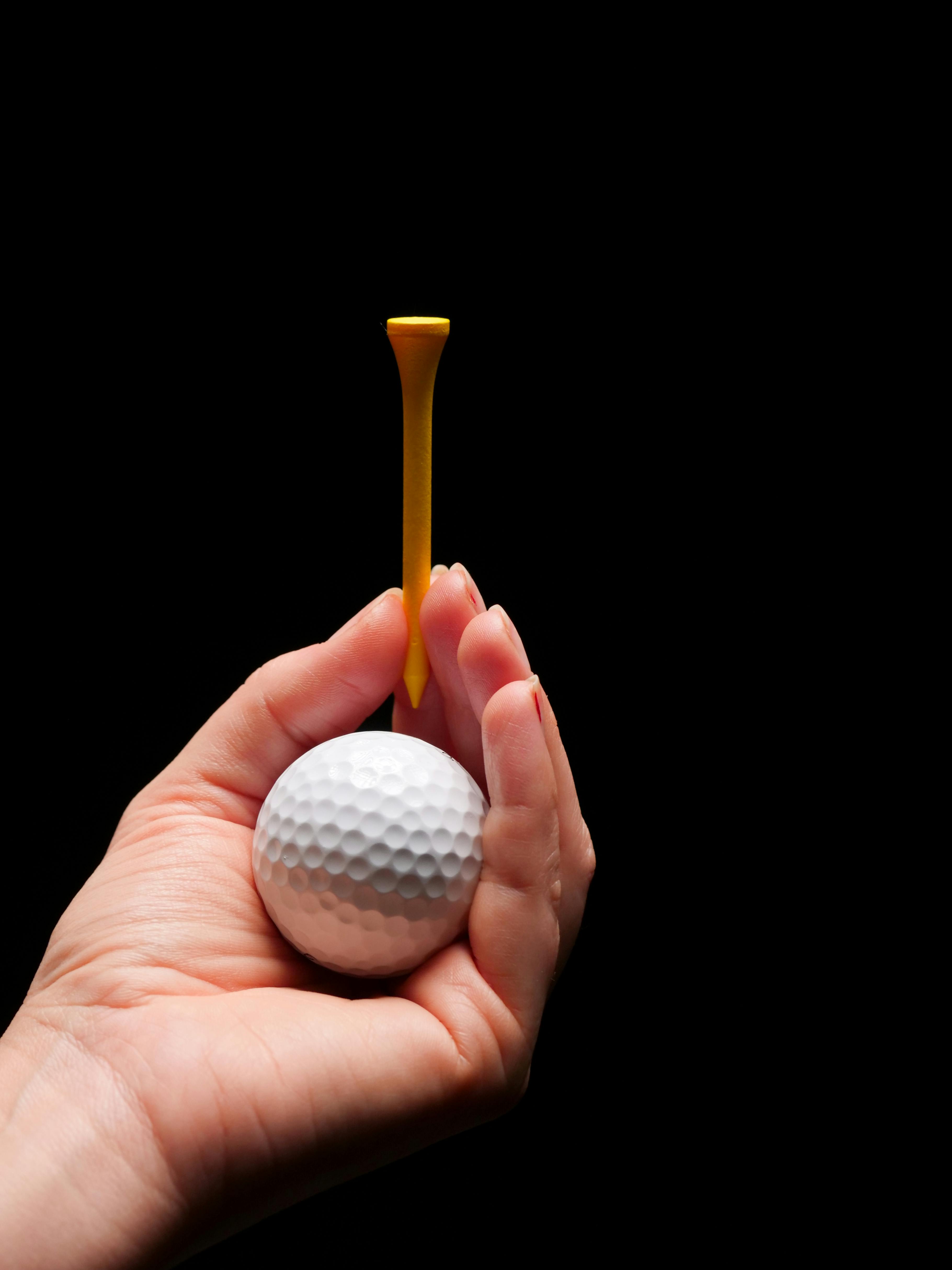 Golf Clipart-hand placing golf ball on tee clipart
