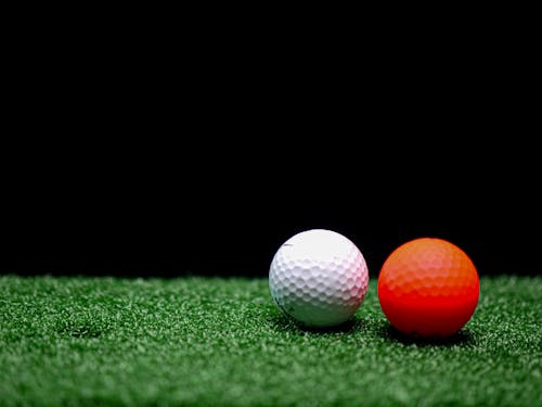 Close-Up Shot of Two Golf Balls on Golf Course