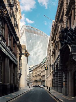 A striking view of London's modern architecture with the Walkie Talkie building framed by historic buildings.