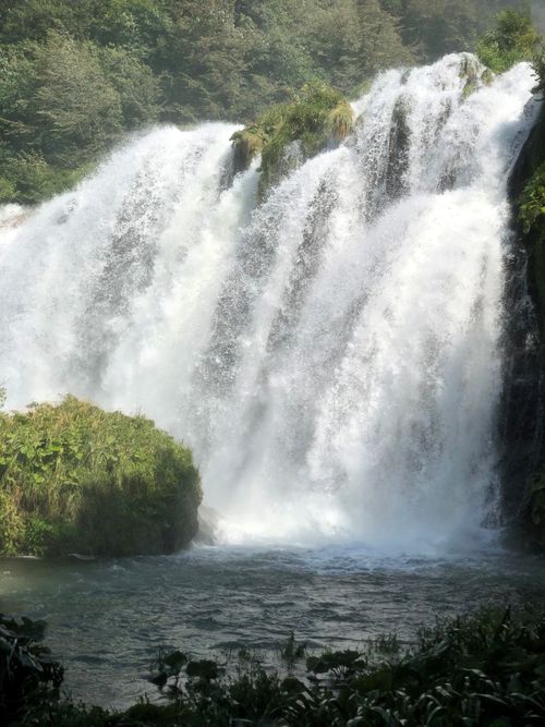 Free Breathtaking view of the Marmore Waterfalls in Umbria, Italy, surrounded by lush greenery. Stock Photo