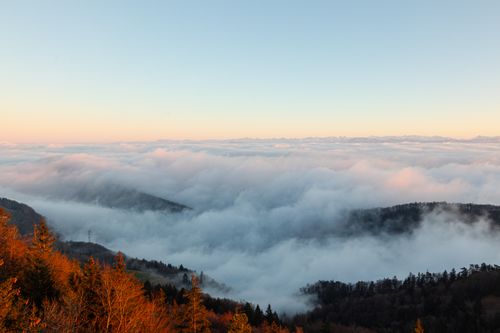 Free Breathtaking aerial view of Eptingen's fog-covered mountains at dawn capturing serene beauty. Stock Photo