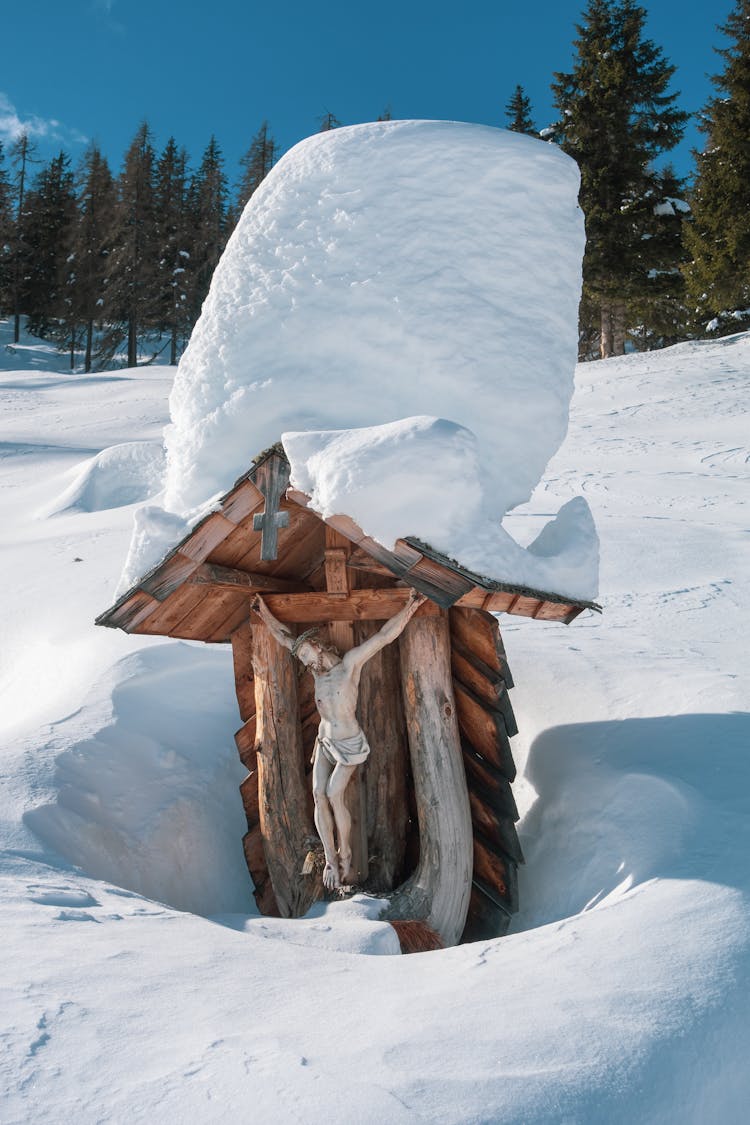 Snow On Wooden Catholic Shrine