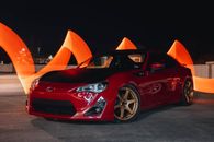 Red Sedan Parked on the Road