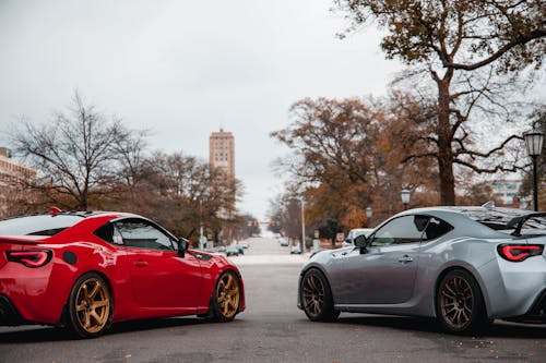 Two Luxury Sports Cars in a City