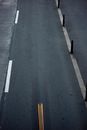 Empty asphalt road with marking lines