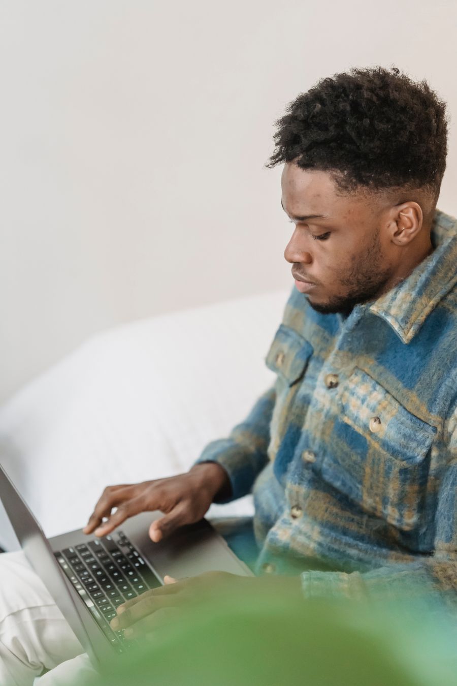 African freelancer learning and working on a laptop