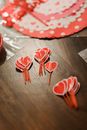 Red heart decorations on wooden table