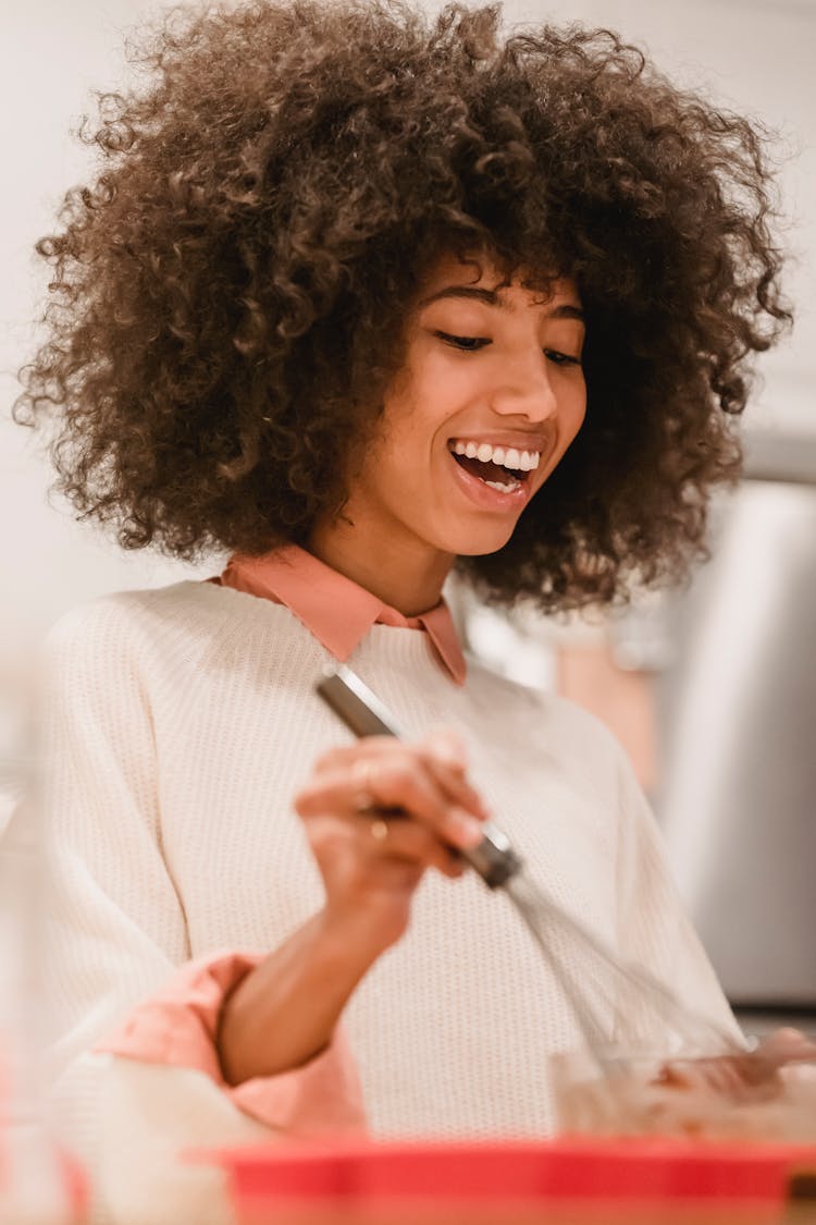 Smiling Black Woman Mixing Batter