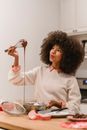 Surprised black woman with liquid chocolate batter