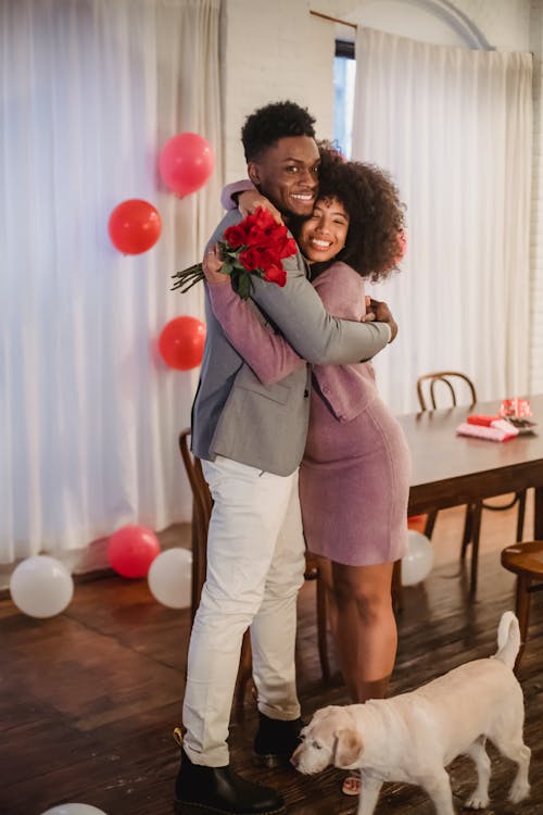 Happy African American couple hugging each other