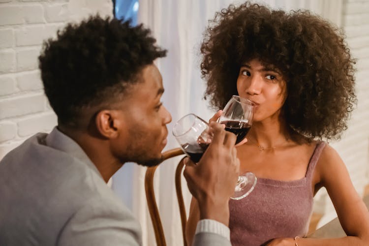 Black Couple Drinking Wine While Having Date At Table