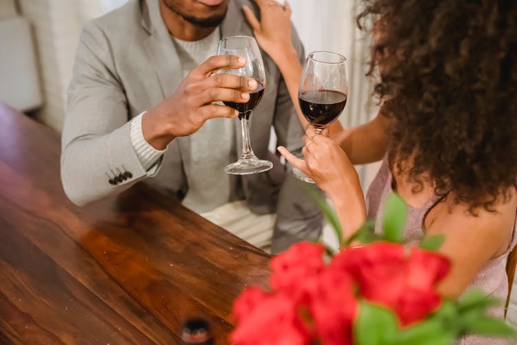 Faceless African American Couple While Drinking Wine At Table