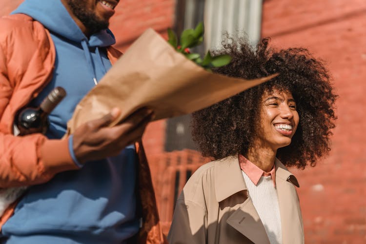 Cheerful Black Couple Walking On Street