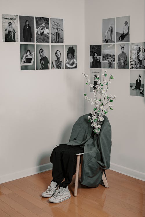 Chair with clothes and flowers in building