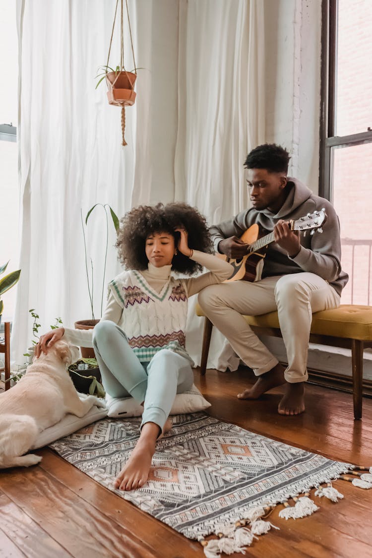 Black Couple With Guitar Near Dog