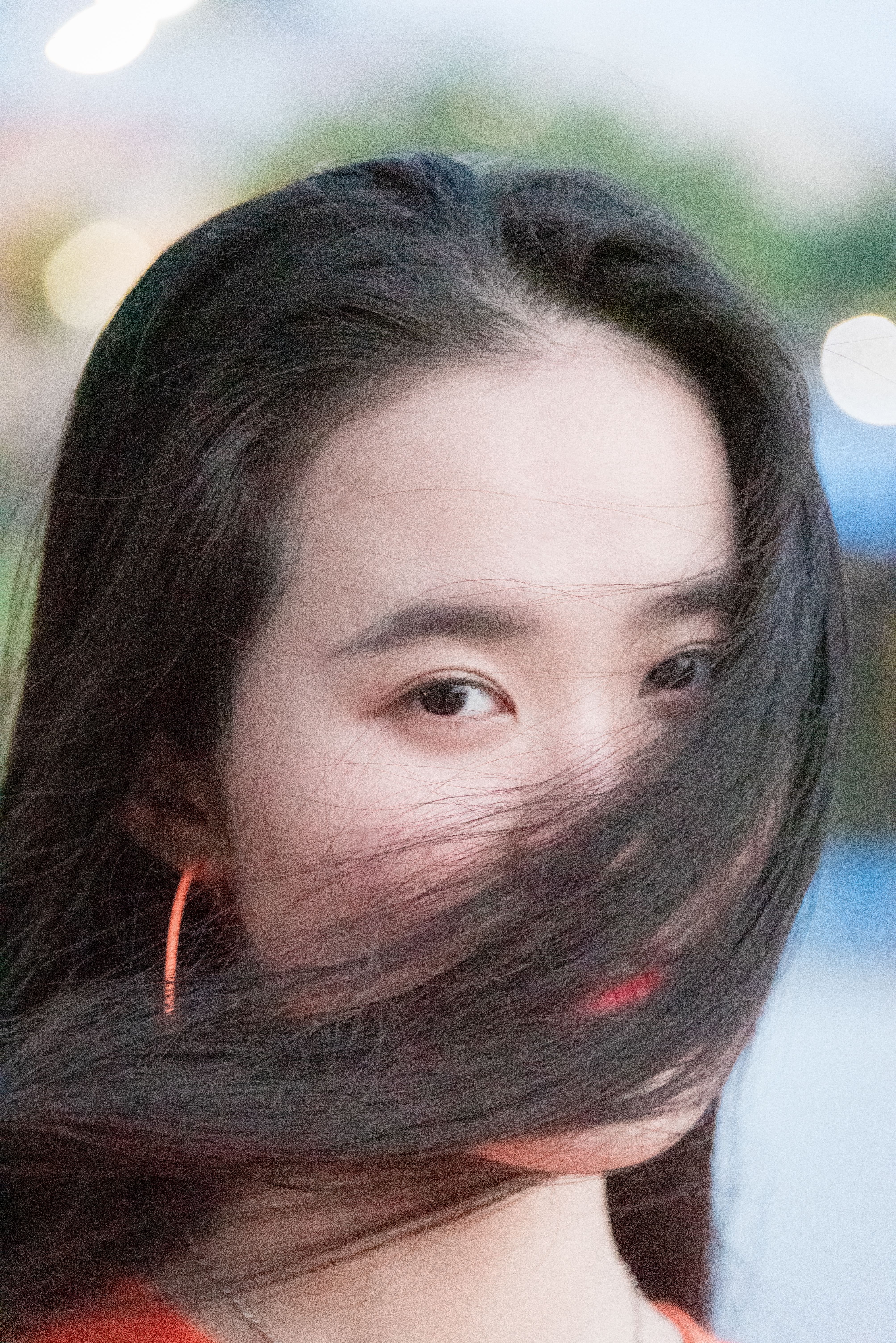 Captivating portrait of a young woman with flowing hair in vibrant Ho Chi Minh City.