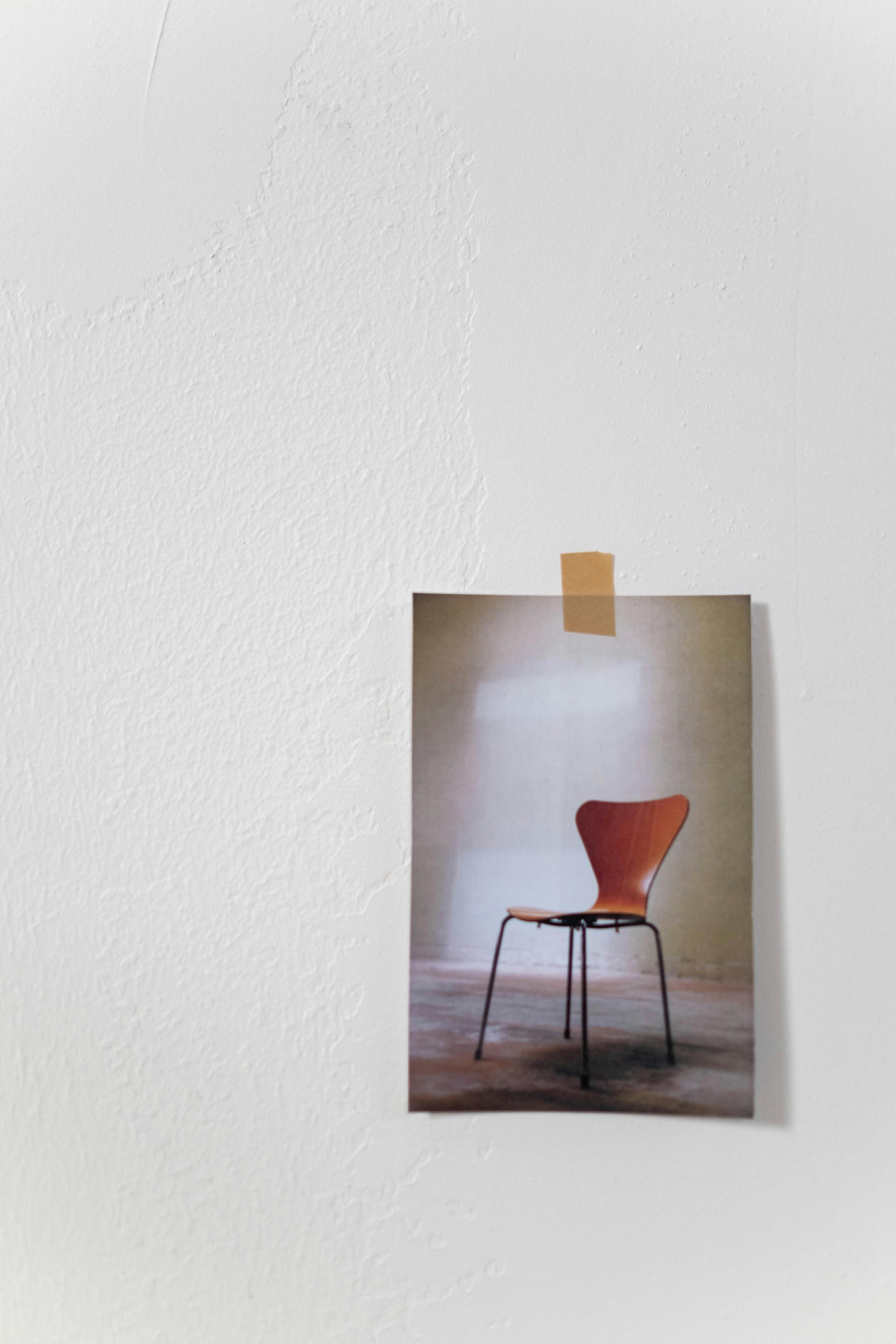 photo of a chair stuck to a wall