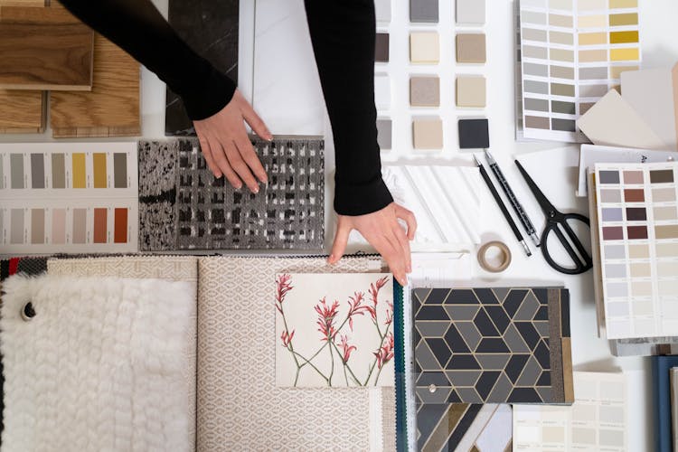 Woman Hands Reaching For Decorative Samples