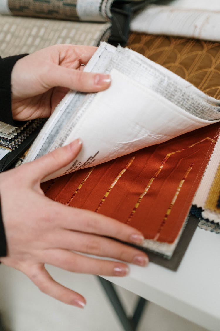 Woman Choosing From Fabric Swatches 