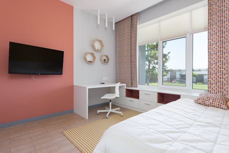 Stylish Interior Of Spacious Bedroom In Red Tones