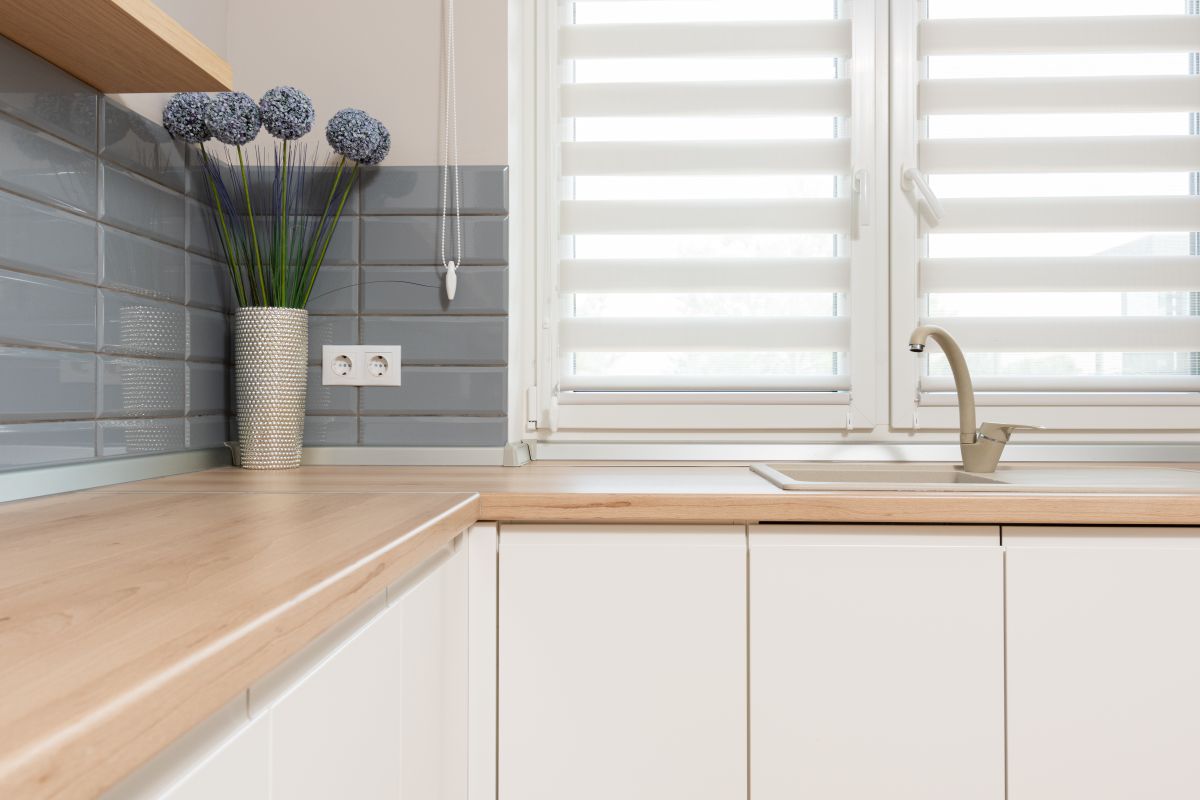 Kitchen with beige cabinetry and walls