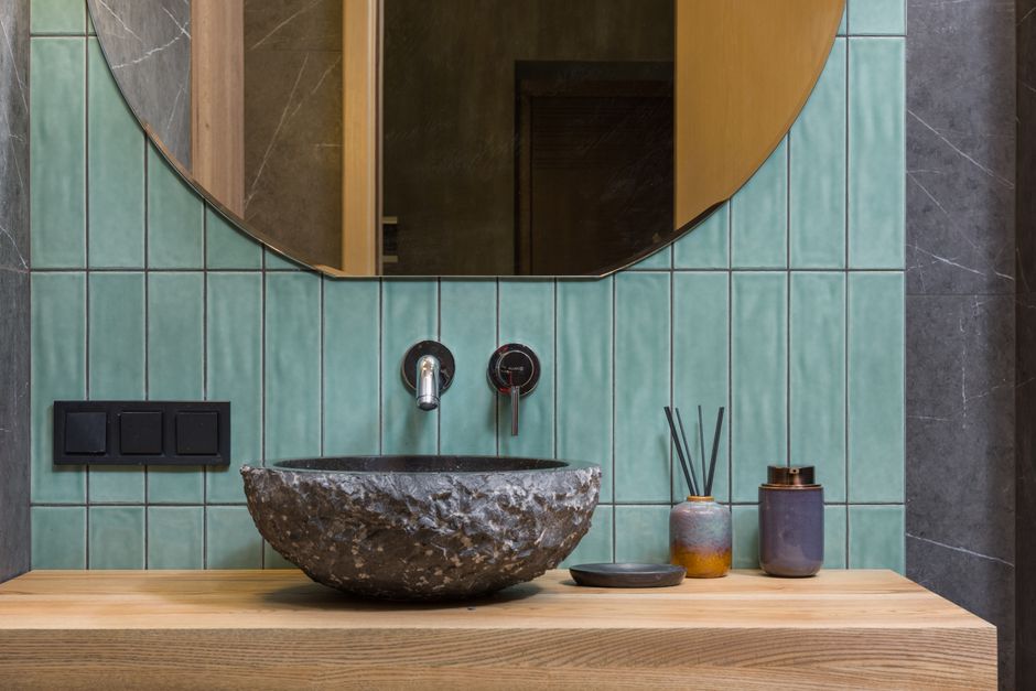 Elegant bathroom featuring a stone washbasin and minimalist design. Elegant bathroom featuring a stone washbasin and minimalist design.