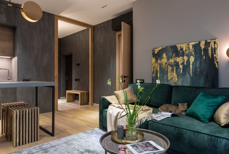 Green velvet sofa in a stylish living room