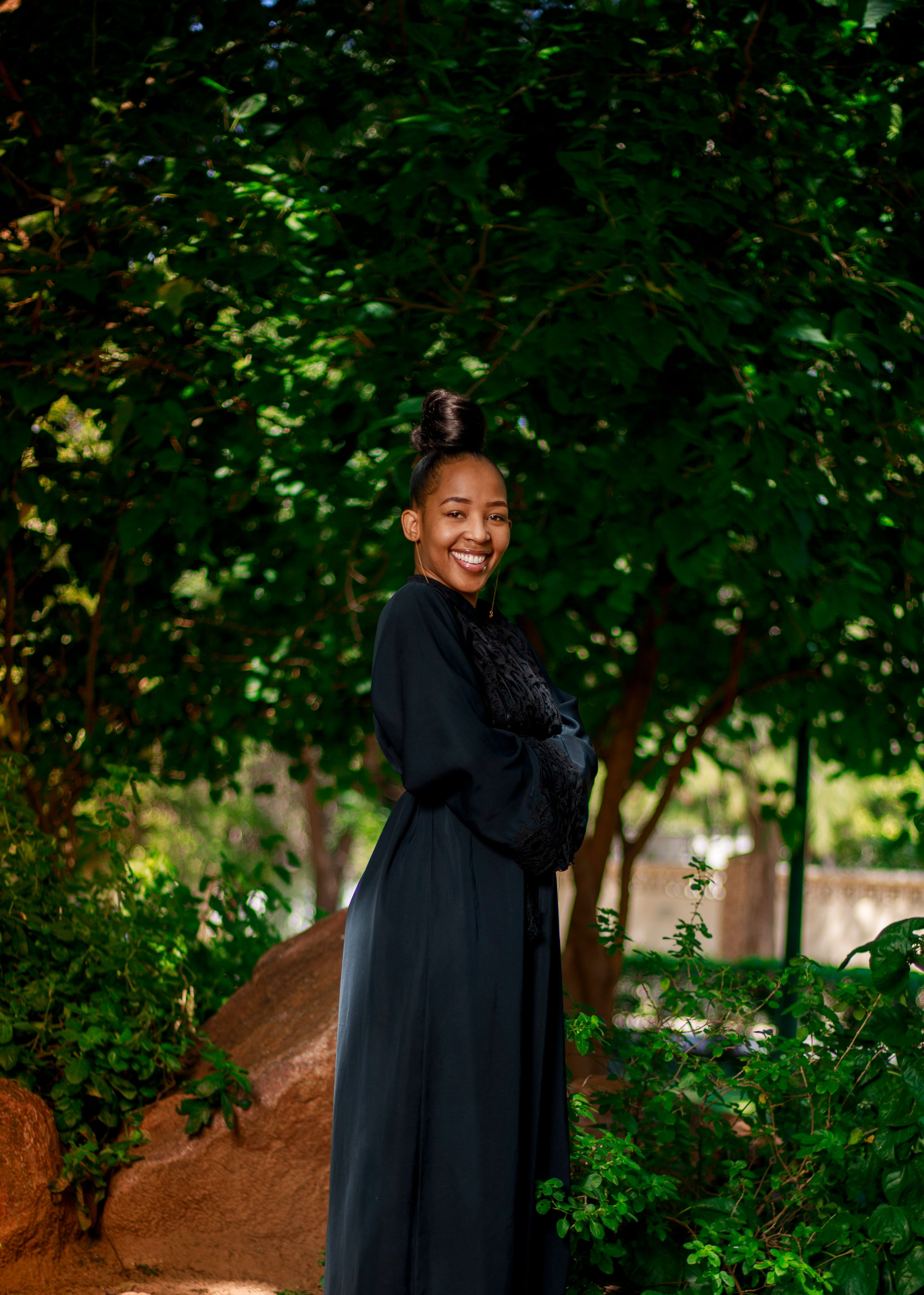 Woman in Black Dress Smiling · Free Stock Photo