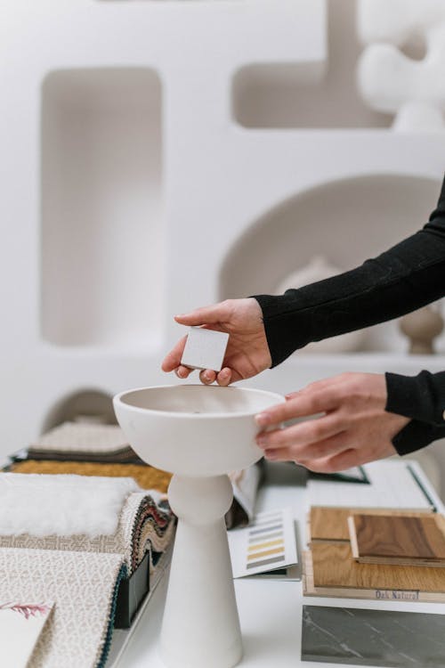 Woman Hands Reaching for Decorative Samples