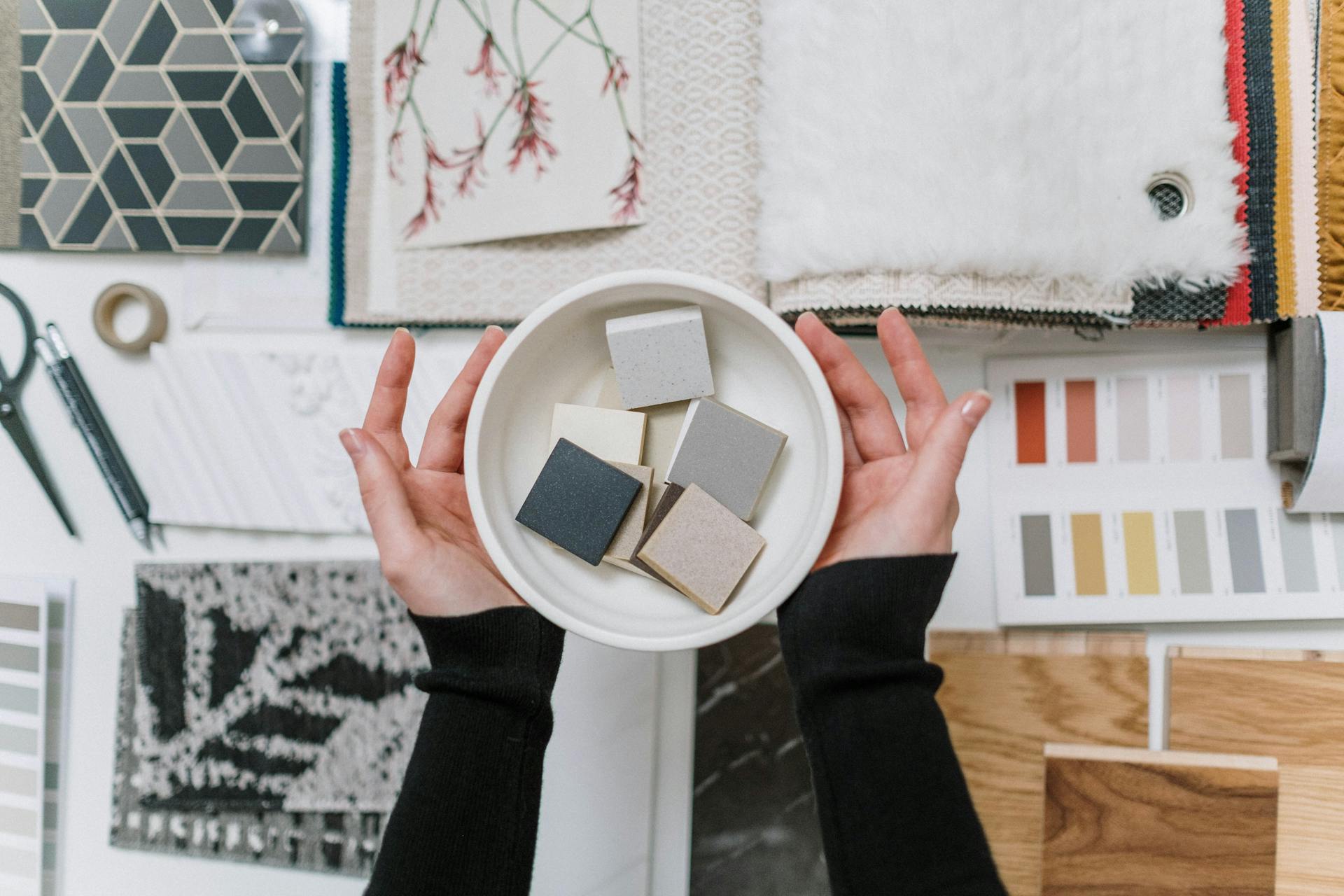 Woman Hands Holding Decorative Samples in Bowl