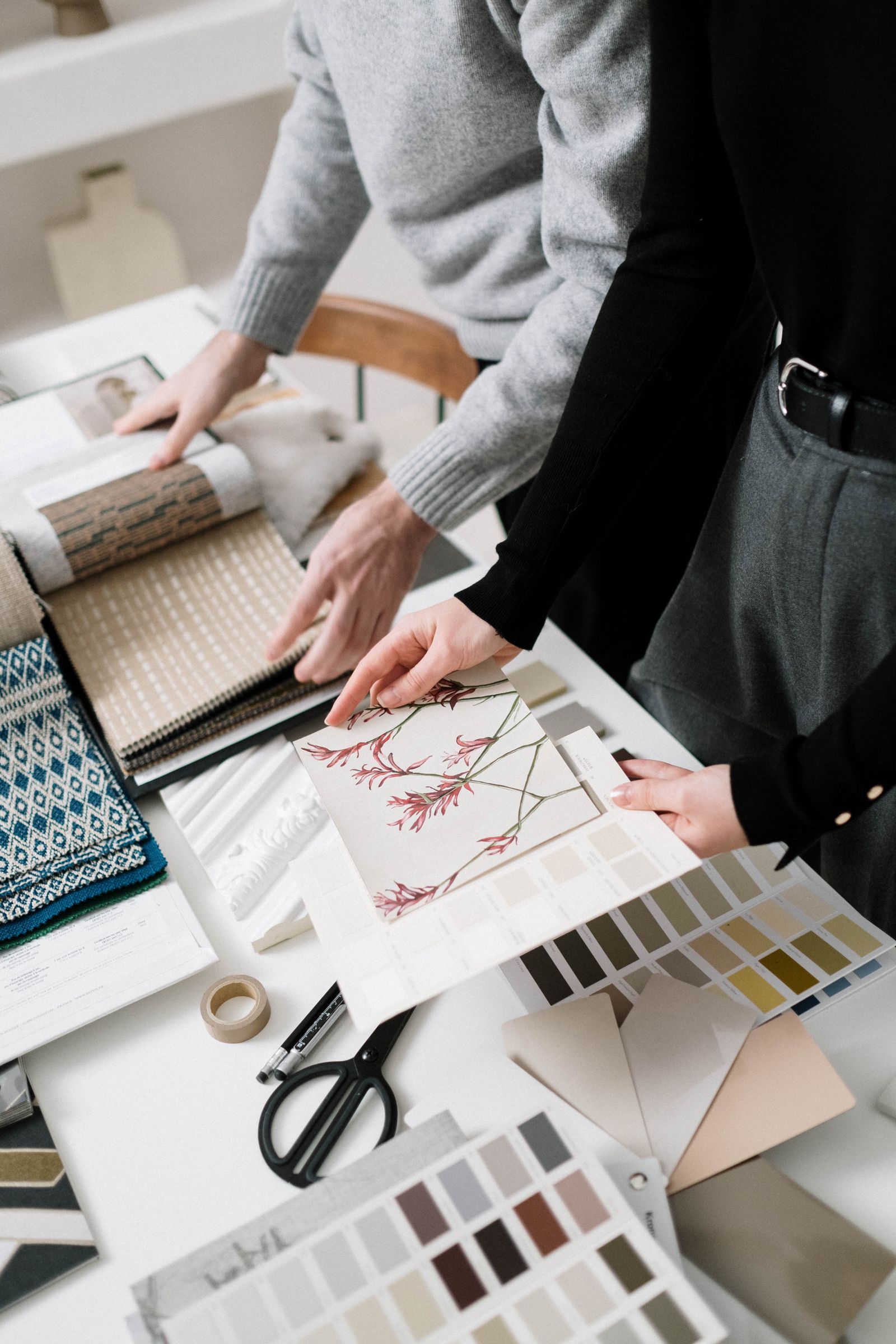 Designers choosing fabric and colour samples