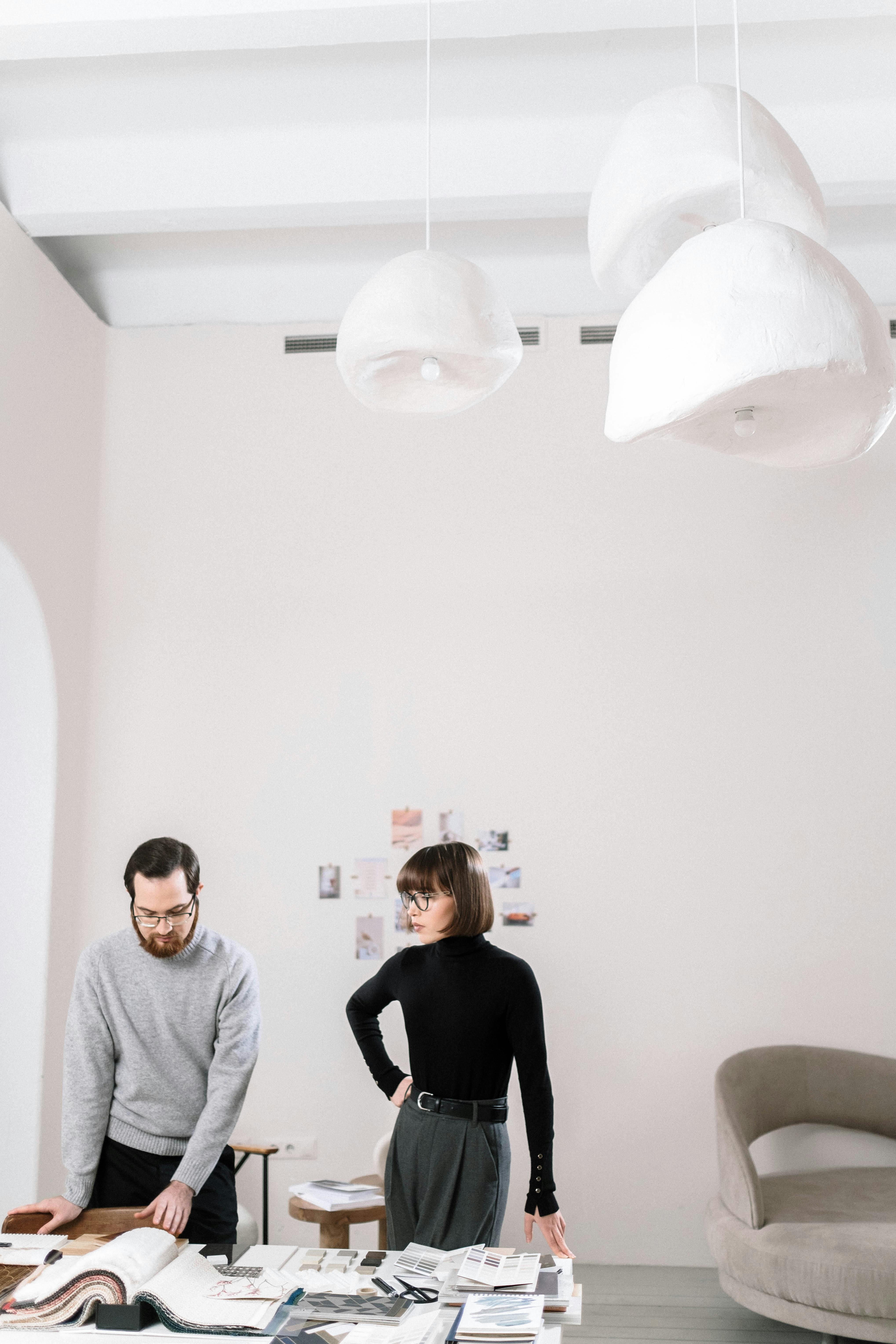 Man and Woman Standing Near the Table