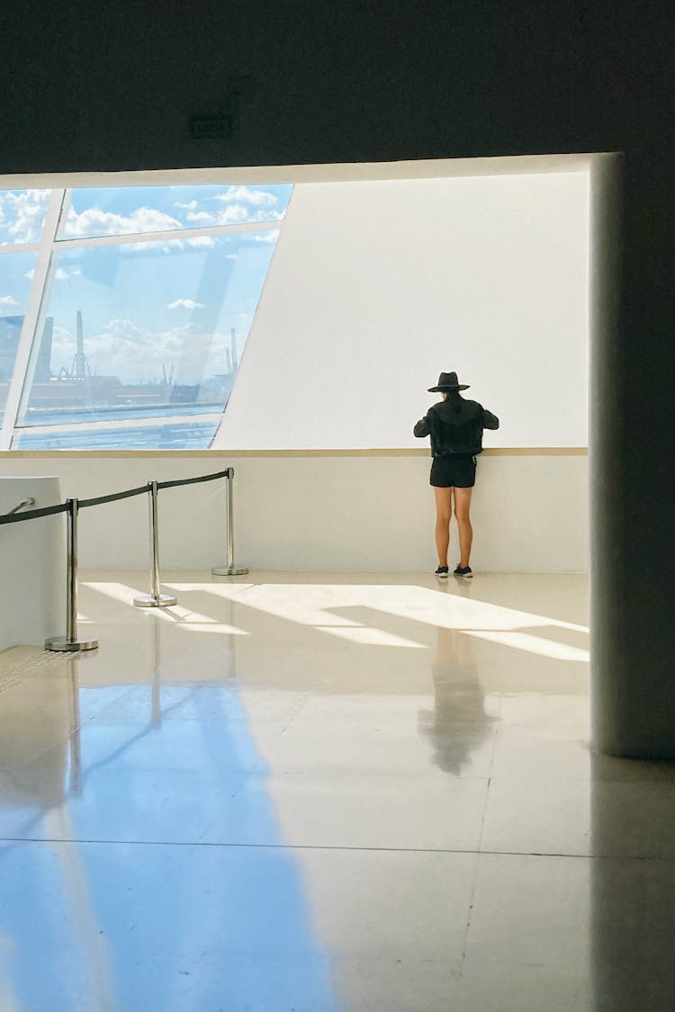 Unrecognizable Traveler On Floor In Airport Building