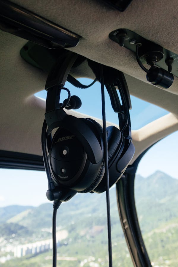 Professional black headphones in transport against ridges