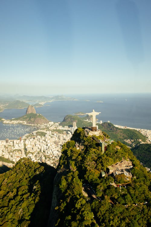 Aerial view of sculpture of Jesus Christ on green mount in Rio de Janeiro Brazil on summer day