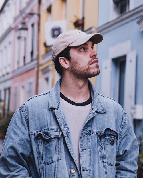 A Man in Denim Jacket Wearing a Cap